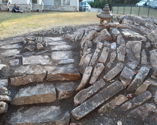 Stone toro (Japanese lantern) in place on the stonework