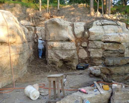 Mary cleaning out a crevice created by a glacier. Mary cleaning out a crevice created by a glacier.