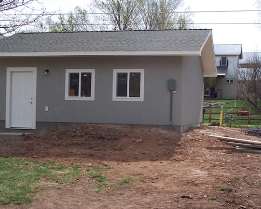 The new garage, with the pile of orange clay subsoil in front that  would become Garage Hill.