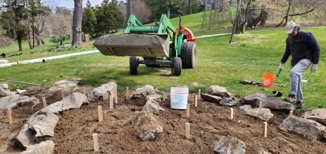 Applying a layer of gravel over the soil